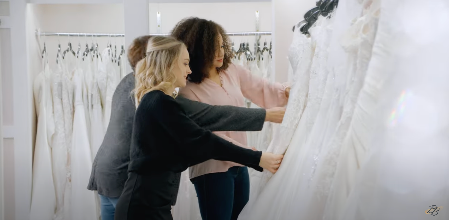 Load video: a becker&#39;s bridal commercial showing three brides shopping with their family at the historic flagship becker&#39;s bridal location in michigan and celebrating their i said yes moment in the phoenix bridal celebratory lounge located within the famous bridal shop